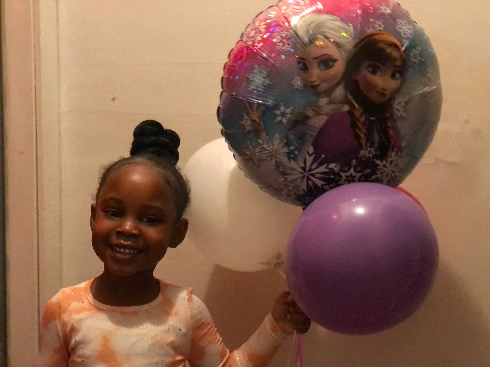 Raven is registered to the contest to win money with this photo: art, ball, balloon, child, event, fun, happy, joy, leisure, magenta, ornament, party_supply, person, pink, room, smile, sphere, toddler, toy, visual_arts