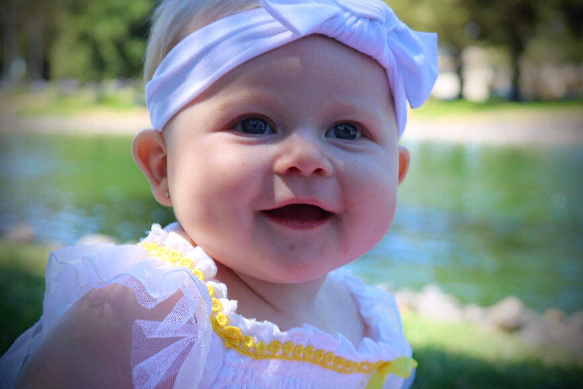 Mya joined the competition — help win amazing prizes! baby, bonnet, cheek, child, close_up, face, facial_expression, hair_accessory, happy, head, headgear, headwear, lip, mouth, nose, person, pink, skin, smile, summer