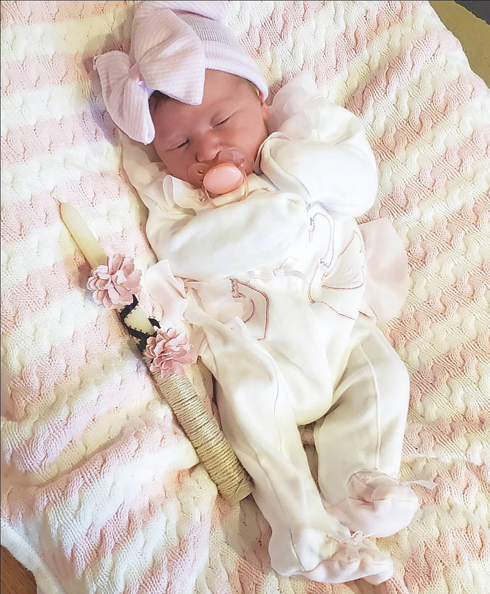 Kaya is registered to the contest to win money with this photo: baby, baby_products, baby_sleeping, baby_toddler_clothing, bed, bedding, child, comfort, cut_flowers, fashion_accessory, hair_accessory, linens, pattern, peach, person, petal, pink, room, sleeve, textile