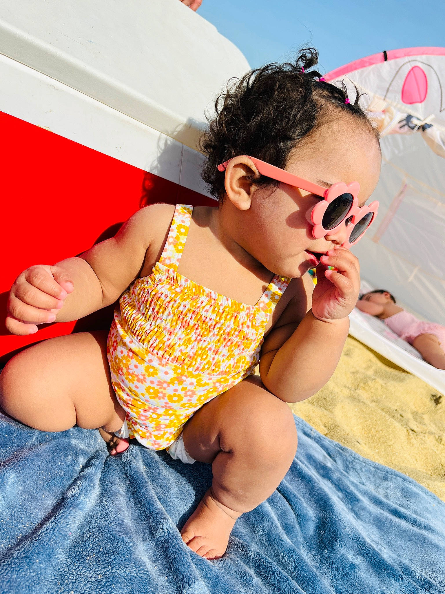 Amalia is registered to the contest to win money with this photo: baby_toddler_clothing, barefoot, blue, child, cool, eyewear, foot, fun, glasses, goggles, happy, leisure, mouth, person, recreation, shorts, summer, sunglasses, thigh, toddler