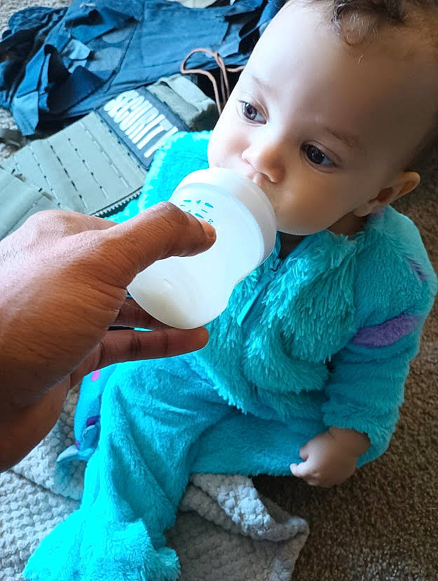 Adonis joined the competition — help win amazing prizes! azure, baby, baby_bottle, baby_toddler_clothing, blue, cheek, drinkware, eye, finger, gesture, hand, mouth, nail, nose, person, plastic_bottle, product, skin, thumb, toddler