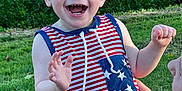 Kadence joined the competition — help win amazing prizes! baby, child, smiling, laughing, outdoor, grass, greenery, striped_clothing, stars, hand, holding, happy, person, summer, sunlight, cute, infant, face, joy, playful