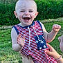 baby, child, smiling, laughing, outdoor, grass, greenery, striped_clothing, stars, hand, holding, happy, person, summer, sunlight, cute, infant, face, joy, playful