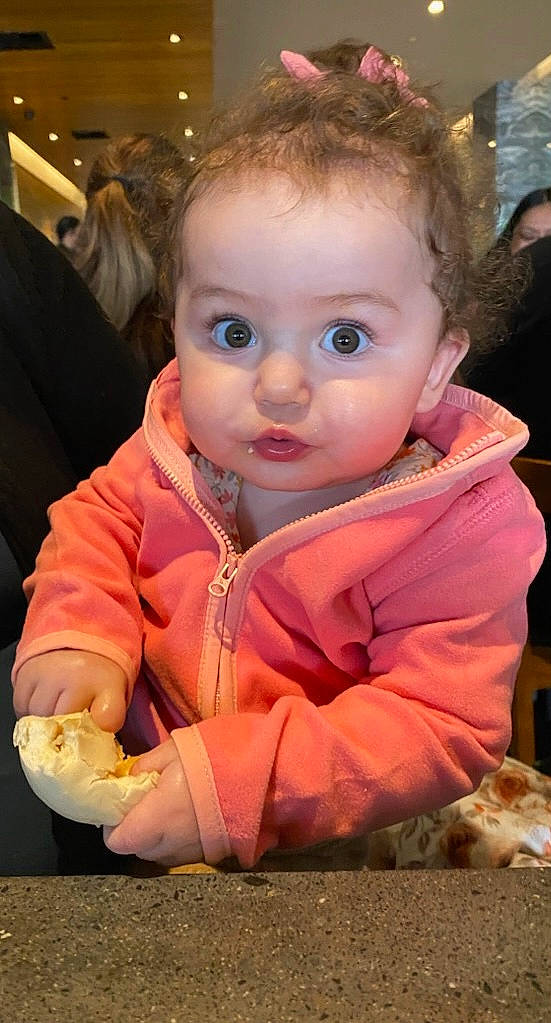 Elyse P is registered to the contest to win money with this photo: baby, baby_toddler_clothing, blond, cheek, child, facial_expression, flooring, fun, fur, hairstyle, happy, head, iris, lip, mouth, nose, person, sitting, skin, toddler