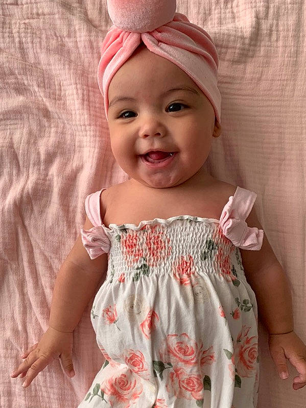 Ayrabella joined the competition — help win amazing prizes! baby, baby_toddler_clothing, child, clothing, dress, fashion_accessory, hair_accessory, headband, headgear, headwear, joy, pattern, peach, person, pink, smile, textile, toddler