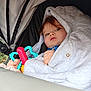 Maylonne a rejoint le concours — aidez-le/la à gagner de superbes lots ! child, baby, toddler, stroller, hood, blanket, toy, teether, blue_eyes, gaze, canopy, jacket, hand, portrait, closeup, candid, expression, seat, fabric, outdoor