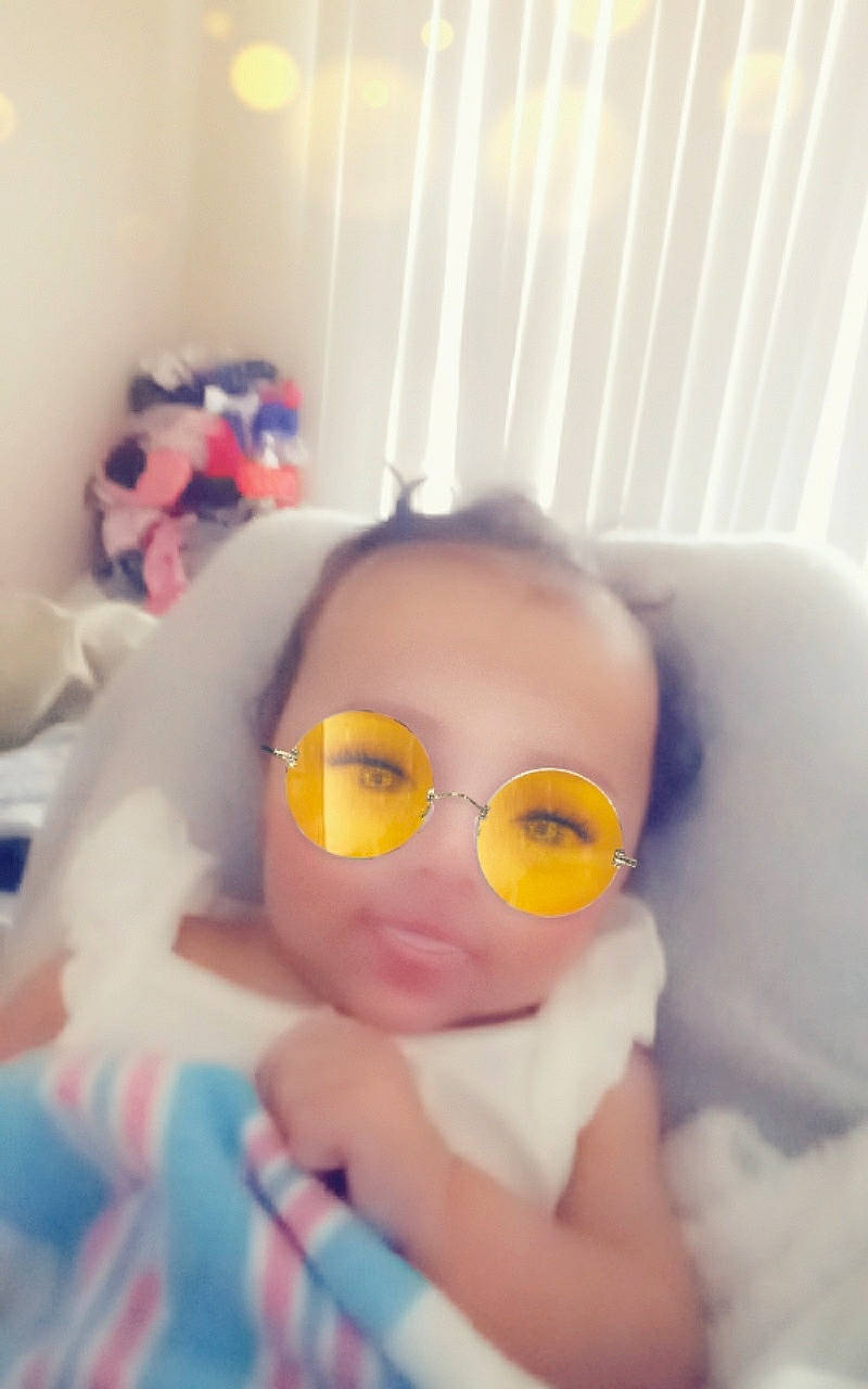 Parish is registered to the contest to win money with this photo: baby, bed, bedtime, cheek, child, cool, eye, eyewear, face, glasses, head, mouth, nose, person, room, selfie, skin, textile, toddler, vision_care