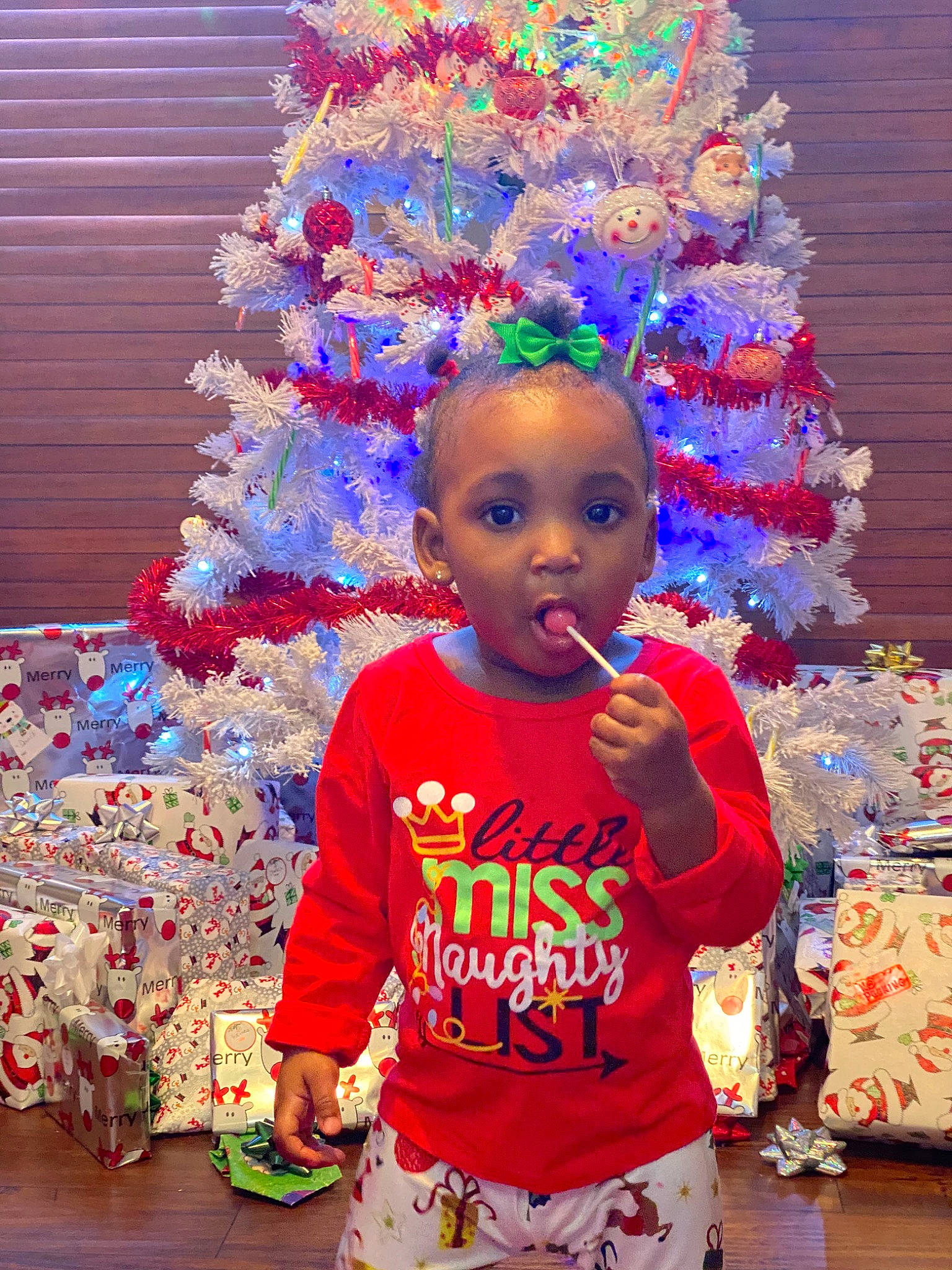 Imani joined the competition — help win amazing prizes! child, christmas, christmas_decoration, christmas_ornament, christmas_tree, event, holiday, interior_design, party_supply, person, surprise, toddler, tradition