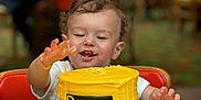 Braylynn joined the competition — help win amazing prizes! birthday_cake, cake, celebration, child, curly_hair, dessert, face, food, frosting, hand, happy, high_chair, icing, indoor, party, person, smiling, table, toddler, yellow_cake