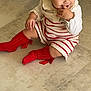 Maria participe au concours pour gagner de l'argent avec cette photo : baby, baby_fashion, candid, child, clothing, cute, earrings, floor, happy, headband, indoor, person, playful, portrait, red_bow, red_socks, sitting, smiling, striped_dress, toddler