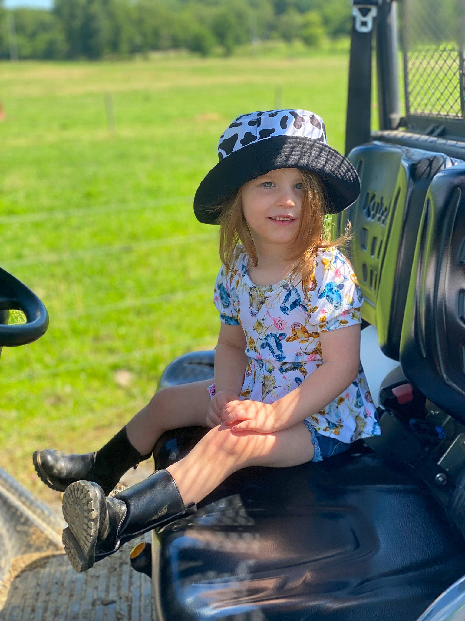 Raegan joined the competition — help win amazing prizes! automotive_design, automotive_exterior, automotive_tire, automotive_wheel_system, bumper, cool, fun, grass, happy, hat, headgear, headwear, joy, leisure, motor_vehicle, person, public_space, recreation, sun_hat, thigh