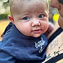 Alexander joined the competition — help win amazing prizes! baby, blue_eyes, face, infant, person, child, clothing, holding, closeup, portrait, cute, skin, cheeks, outdoor, blurred_background, adult, necklace, tattoo, expression, curious