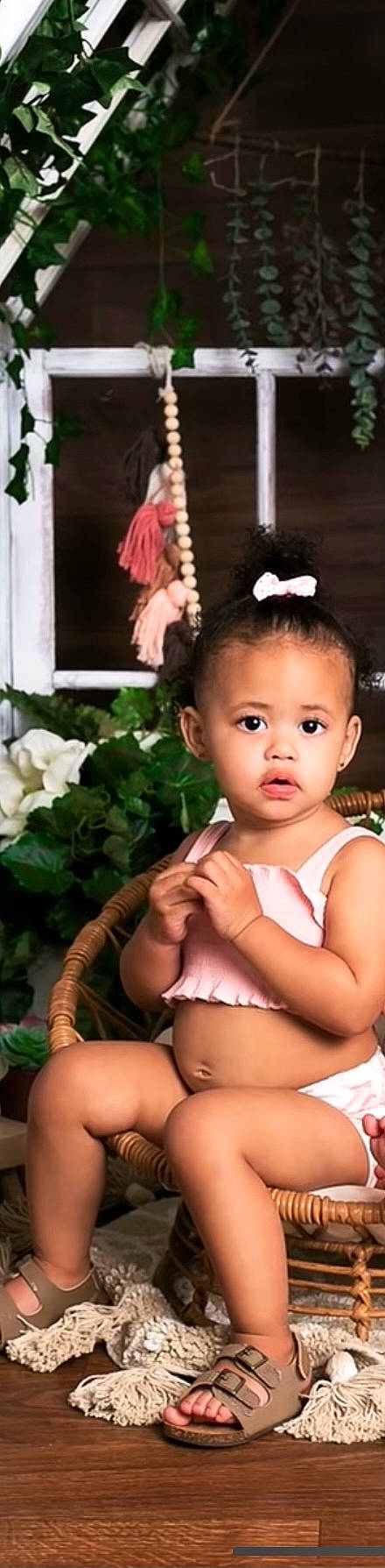 Kynleigh joined the competition — help win amazing prizes! baby_toddler_clothing, black_hair, cheek, chest, ear, eye, eyebrow, eyelash, flash_photography, happy, headband, headpiece, iris, long_hair, neck, person, petal, pink, plant, toddler