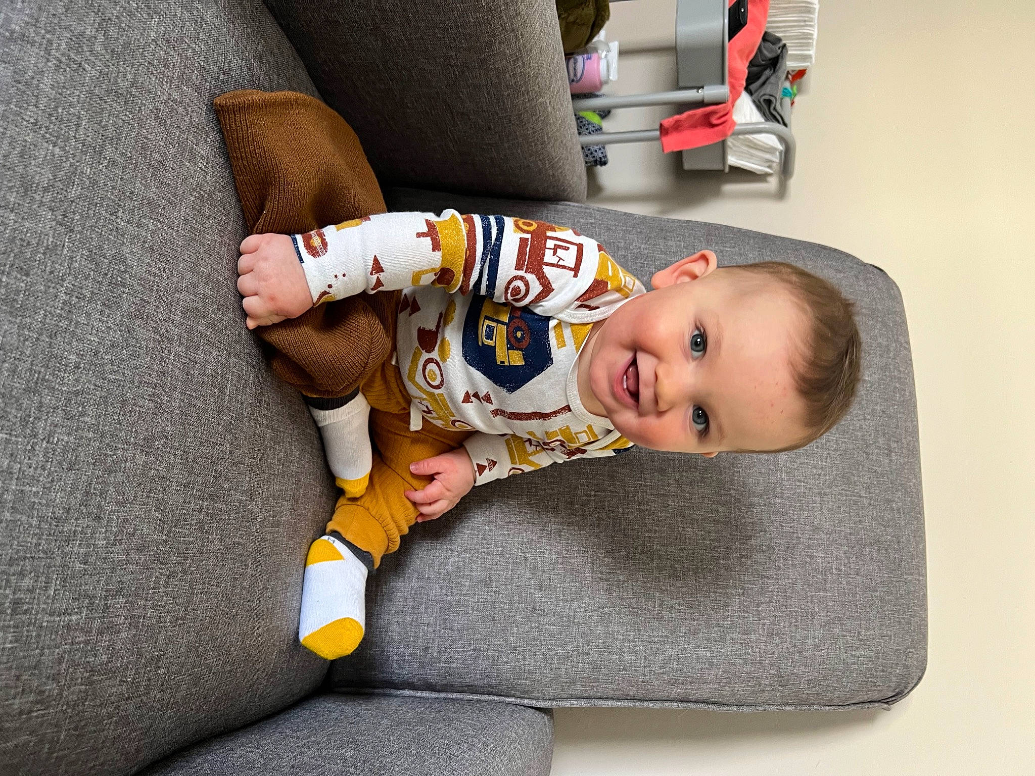 Emmanuel joined the competition — help win amazing prizes! baby, baby_products, baby_safety, baby_toddler_clothing, car_seat, child, comfort, couch, flooring, fun, human_leg, joy, knee, lap, linens, person, room, sitting, sleeve, smile