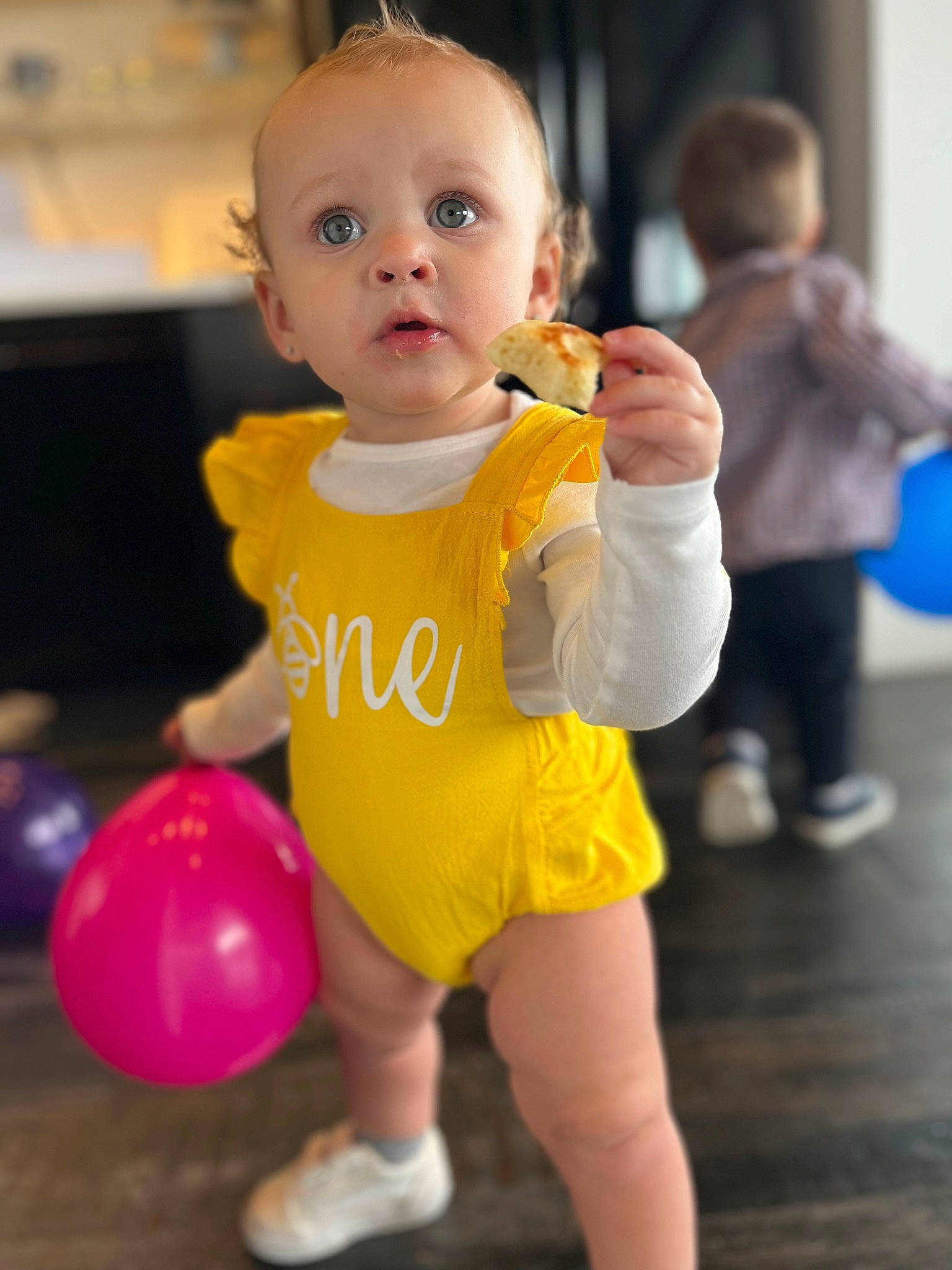 Fayth is registered to the contest to win money with this photo: baby, baby_toddler_clothing, balloon, child, event, facial_expression, flooring, fun, happy, joint, leisure, party_supply, person, pink, play, sitting, sleeve, snapshot, standing, surprise