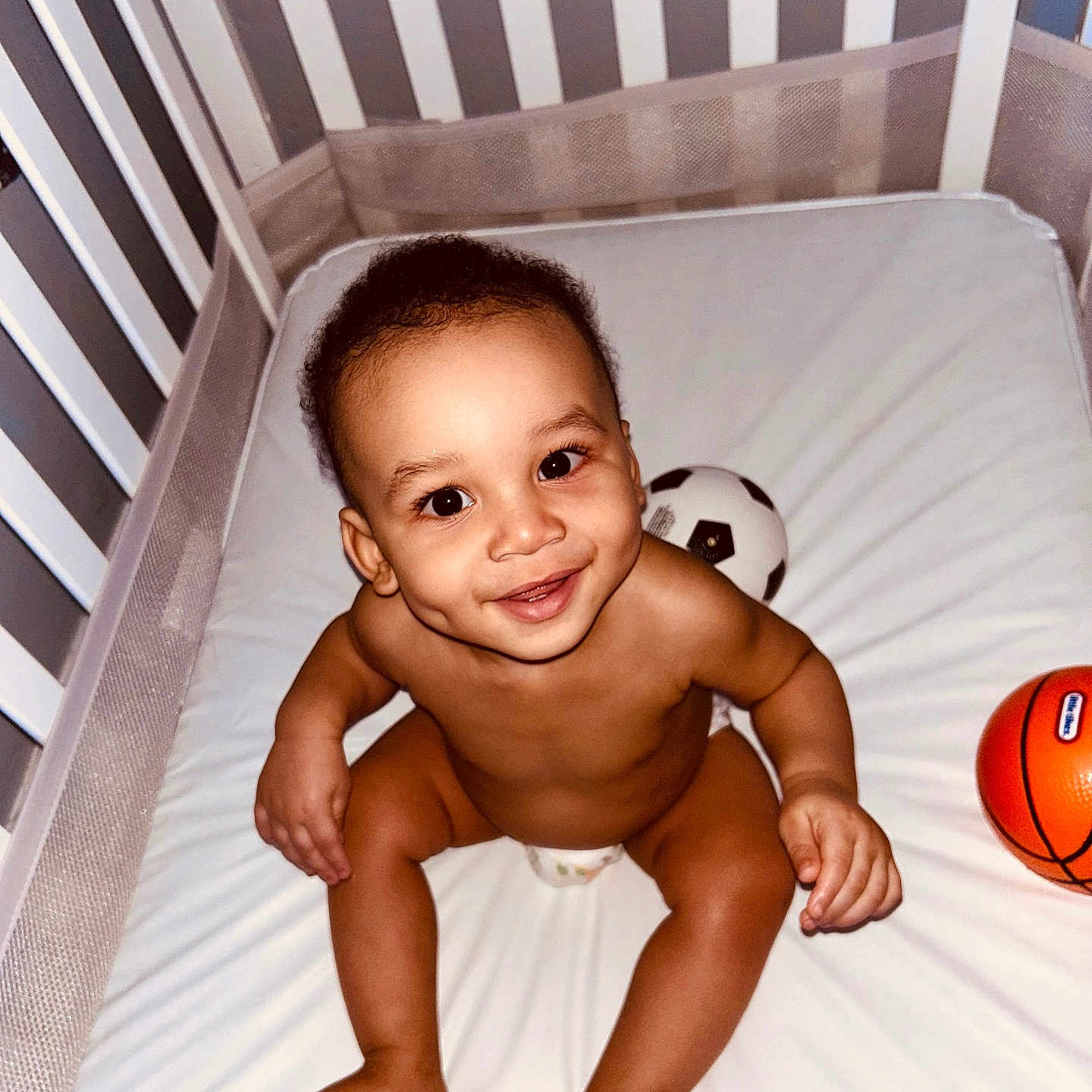 Braylen joined the competition — help win amazing prizes! baby, ball, baseball, baseballball, basketball, basketballball, crib, face, football, furniture, head, infantbed, person, photography, pingpong, pingpongpaddle, portrait, soccer, soccerball, sport