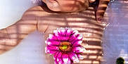 Manéa participe au concours pour gagner de l'argent avec cette photo : baby, bath, child, closeup, cute, floating, flower, flower_petals, hand, infant, milk_bath, peaceful, pink_flower, portrait, relaxation, shadow, skin, support, tattoo, water