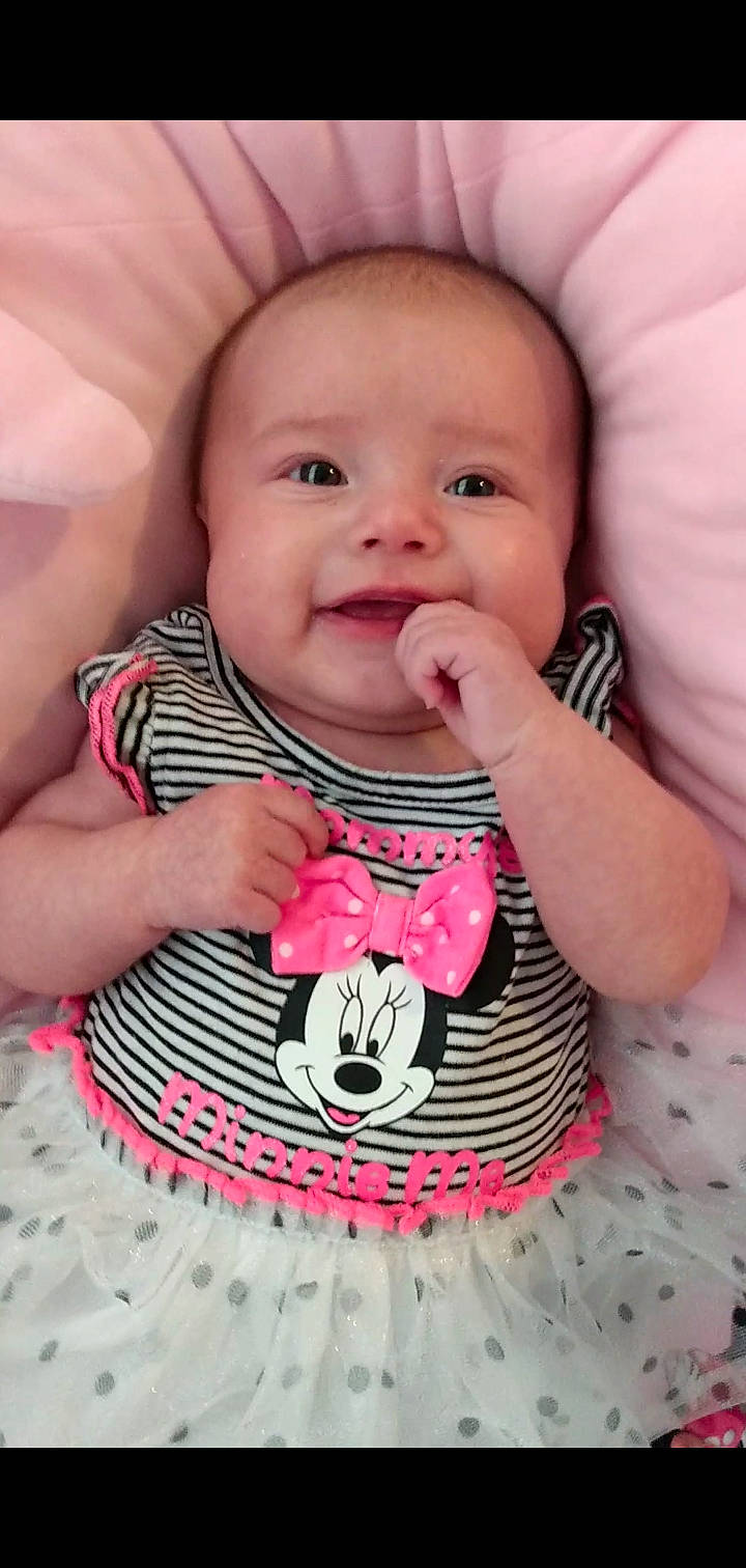 Stephanie is registered to the contest to win money with this photo: baby, baby_laughing, baby_products, baby_toddler_clothing, cheek, child, face, facial_expression, happy, head, joy, lip, mouth, nose, person, pink, play, skin, smile, sweetness