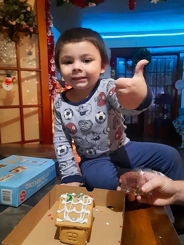Rj is registered to the contest to win money with this photo: baby, baby_toddler_clothing, box, cardboard, carton, child, event, fun, happy, icing, joy, leisure, packaging_and_labeling, person, play, recreation, shipping_box, sitting, smile, t_shirt