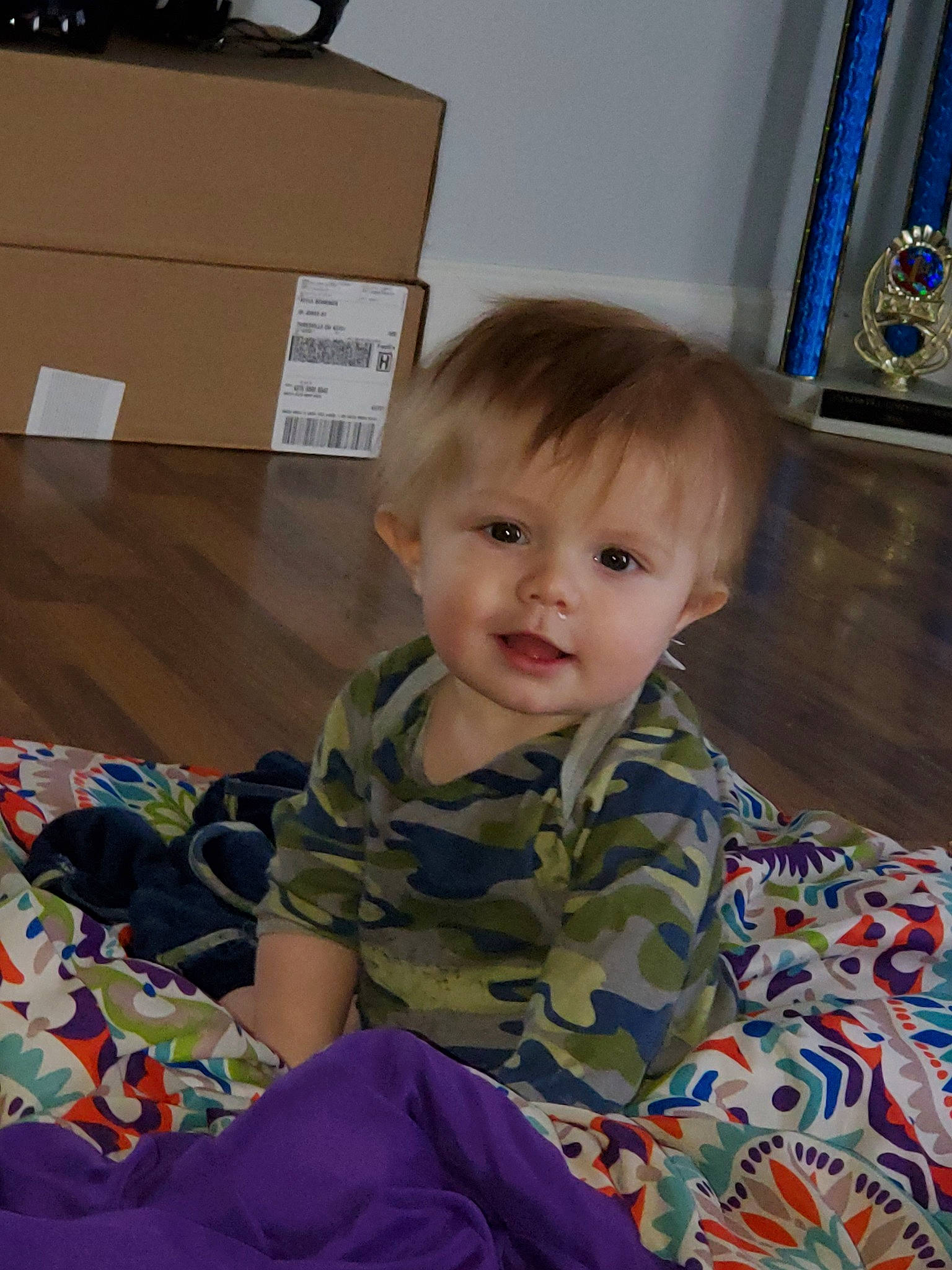 Rowdy is registered to the contest to win money with this photo: baby, cheek, child, eye, head, iris, person, play, sitting, skin, smile, toddler