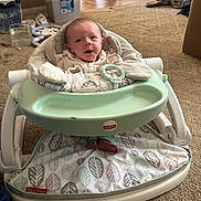 Aviya joined the competition — help win amazing prizes! baby, infant, baby_seat, fisher_price, carpet, indoor, person, feet, toy, household, floor, door, walking, plastic_container, plate, food, slippers, clothing, face, expression