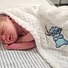 Ronald joined the competition — help win amazing prizes! newborn, baby, sleeping, blanket, striped_towel, soft_texture, cute_character, stitch, infant, resting, peaceful, wrapped, indoors, portrait, child, small, cozy, soft_lighting, closeup, human