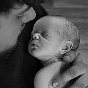Stetson joined the competition — help win amazing prizes! baby, newborn, infant, sleeping, parent, father, hand, holding, portrait, black_and_white, closeup, skin, ear, face, fingers, tenderness, family, love, peaceful, cuddle