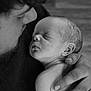 baby, newborn, infant, sleeping, parent, father, hand, holding, portrait, black_and_white, closeup, skin, ear, face, fingers, tenderness, family, love, peaceful, cuddle