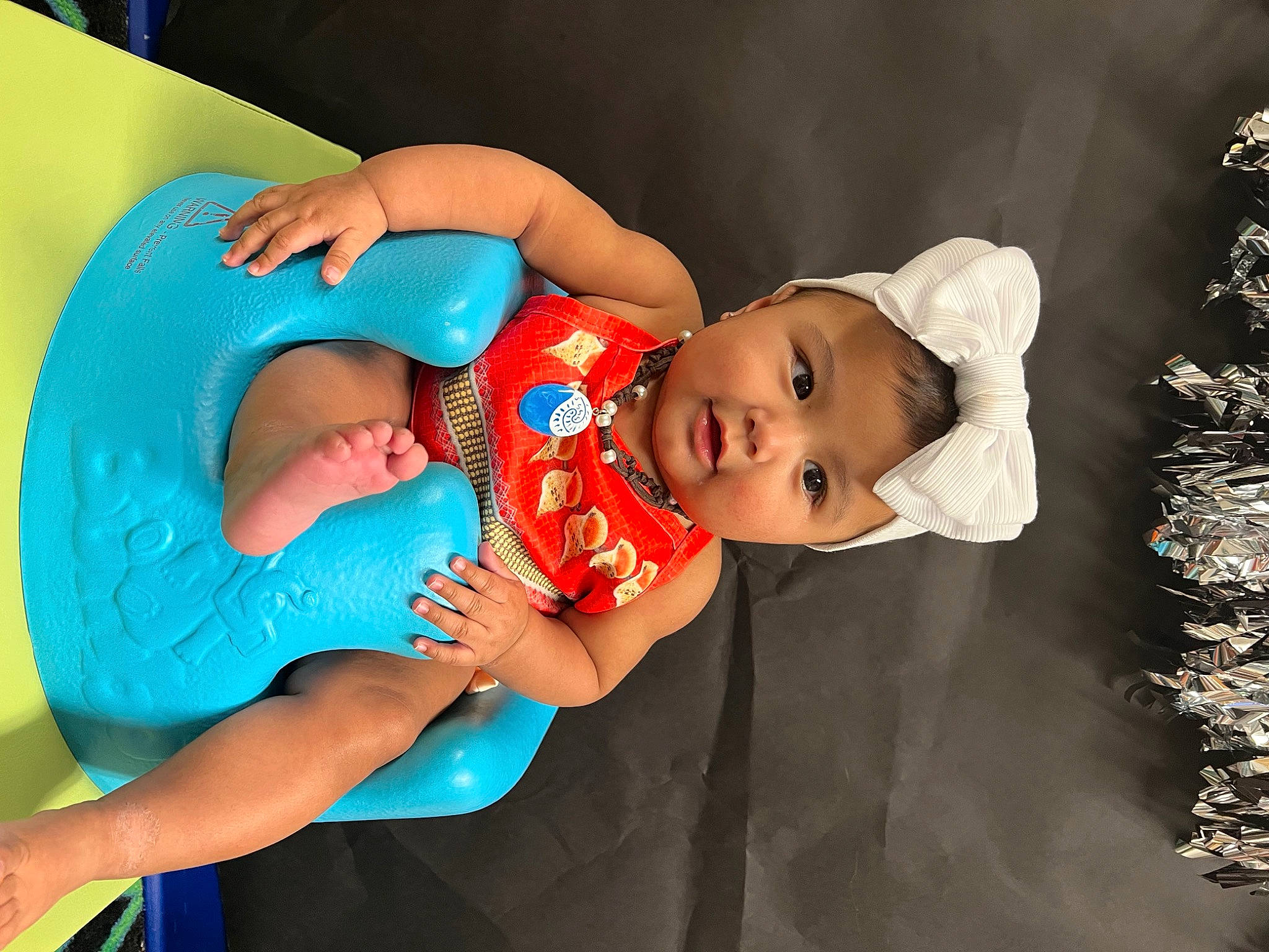Cataleya is registered to the contest to win money with this photo: abdomen, baby, baby_products, baby_toddler_clothing, child, comfort, elbow, electric_blue, event, flash_photography, fun, hand, happy, hat, leisure, person, play, sitting, thigh, toddler