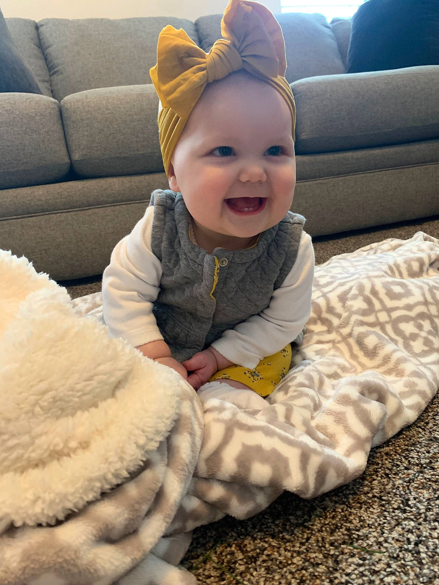 Paityn is registered to the contest to win money with this photo: baby, cheek, child, comfort, ear, face, fur, head, headwear, joy, person, sitting, skin, smile, toddler