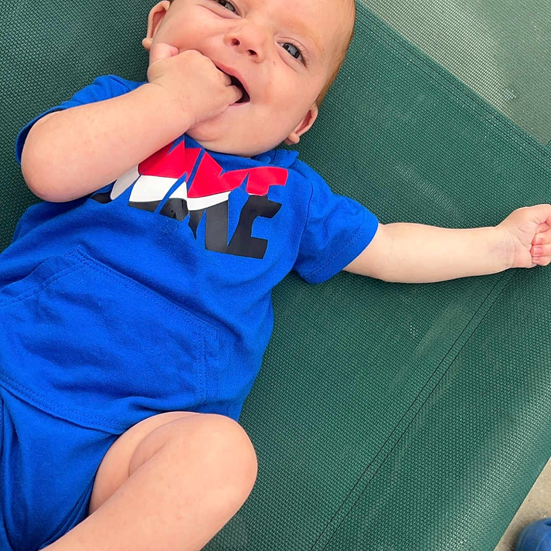 Giovani joined the competition — help win amazing prizes! baby, bodypart, clothing, couch, face, finger, footwear, furniture, hand, head, mouth, pants, person, photography, portrait, shoe, shorts, sitting, t_shirt, teeth