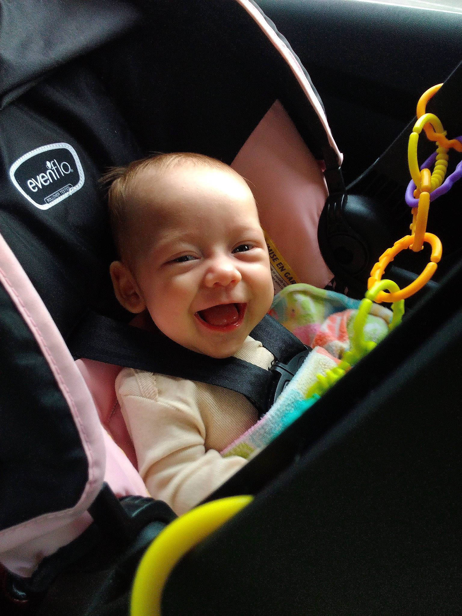 Luna is registered to the contest to win money with this photo: auto_part, automotive_design, baby, baby_carriage, baby_in_car_seat, baby_products, baby_toddler_clothing, car_seat, cheek, child, comfort, facial_expression, fun, grass, happy, motor_vehicle, person, sitting, smile, steering_wheel