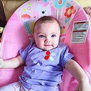 Jade participe au concours pour gagner de l'argent avec cette photo : baby, baby_seat, blue_eyes, child, clothing, comfort, cute, flowers, happy, indoor, infant, person, pink_pants, polka_dots, portrait, purple_shirt, seat, smiling, soft_lighting, unicorn