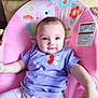 baby, baby_seat, blue_eyes, child, clothing, comfort, cute, flowers, happy, indoor, infant, person, pink_pants, polka_dots, portrait, purple_shirt, seat, smiling, soft_lighting, unicorn