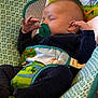 Weston is registered to the contest to win money with this photo: baby, sleeping, pacifier, baby_seat, colorful, frog, nature, child, infant, clothing, cute, peaceful, indoor, comfort, hands, face, rest, toddler, soft, cozy