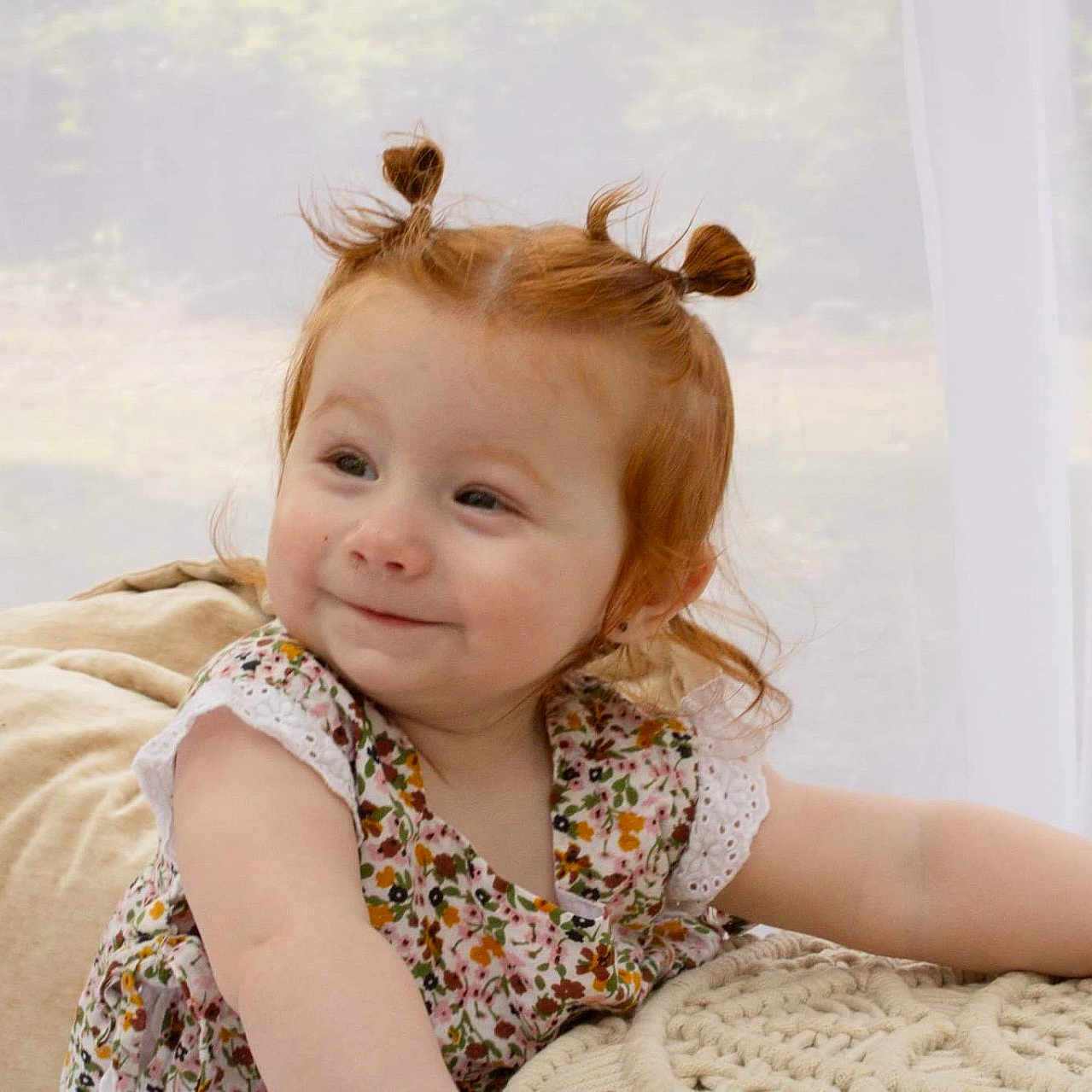 Phoebe is registered to the contest to win money with this photo: blonde, child, clothing, couch, cushion, dress, face, female, furniture, girl, hair, happy, head, homedecor, person, photography, portrait, sitting, smile, window