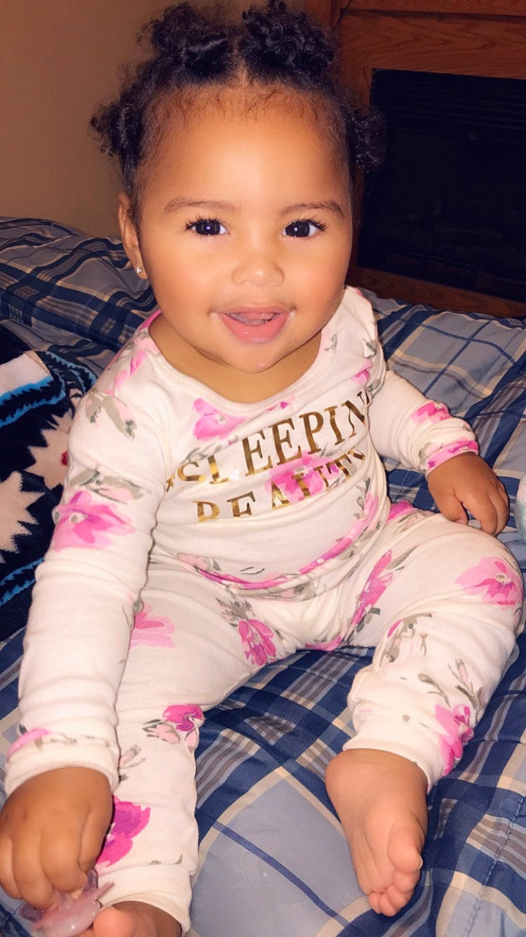 Jaida is registered to the contest to win money with this photo: baby, beauty, cheek, child, chin, cool, daughter, eye, face, forehead, head, lip, nose, person, pink, sitting, skin, sleeve, smile, t_shirt