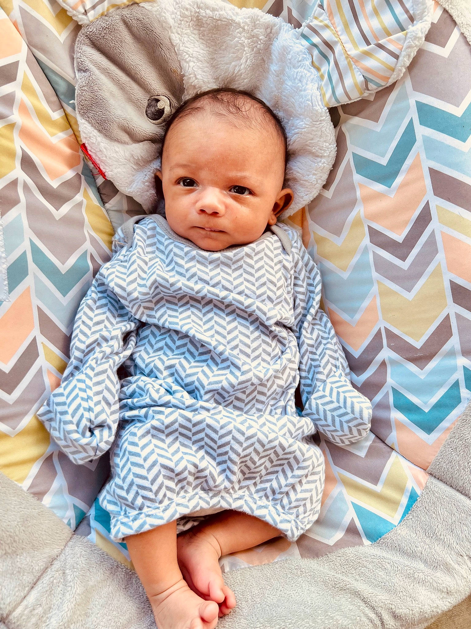Carter joined the competition — help win amazing prizes! baby, baby_products, baby_sleeping, baby_toddler_clothing, bedding, cheek, child, collar, comfort, face, foot, linens, pattern, person, plaid, portrait_photography, sitting, skin, sleeve, toddler