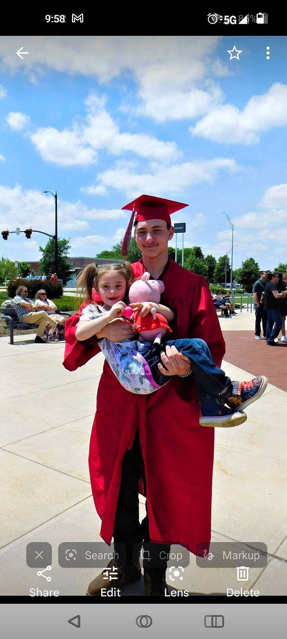Tina is registered to the contest to win money with this photo: academic_dress, cloud, costume, event, fun, graduation, happy, hat, headwear, joy, leisure, mortarboard, person, recreation, shorts, sky, smile, sun_hat, toddler, tourism