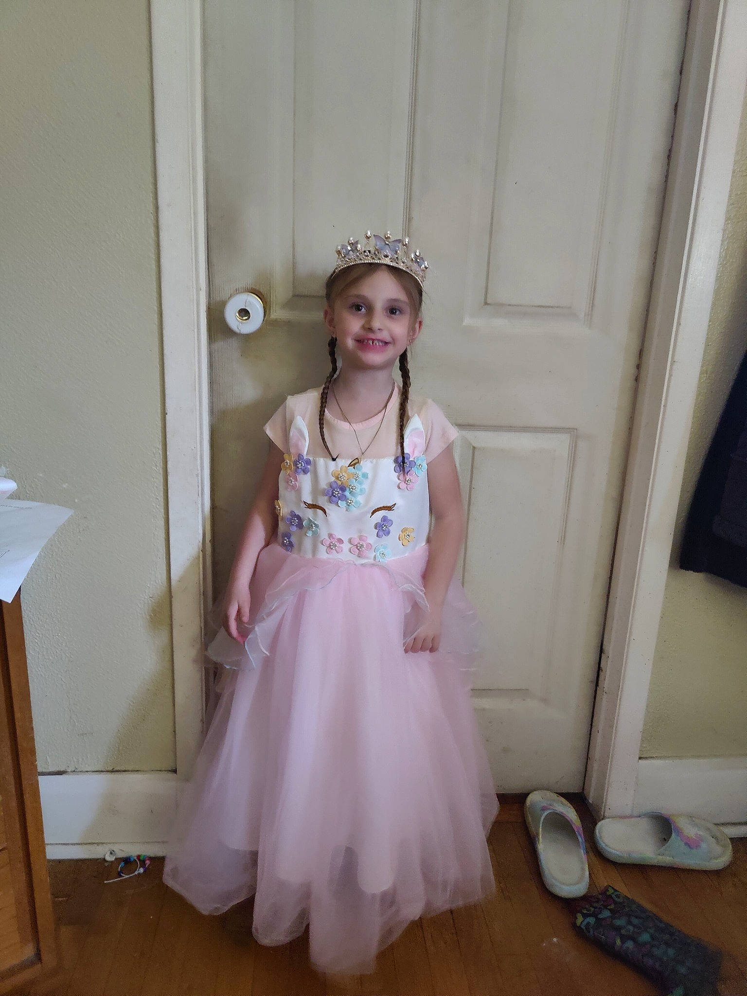 Tina Nicole is registered to the contest to win money with this photo: baby_toddler_clothing, bridal_accessory, bridal_clothing, child, day_dress, dress, embellishment, eye, fashion_design, flooring, formal_wear, fun, gown, happy, headpiece, headwear, joy, magenta, person, sleeve
