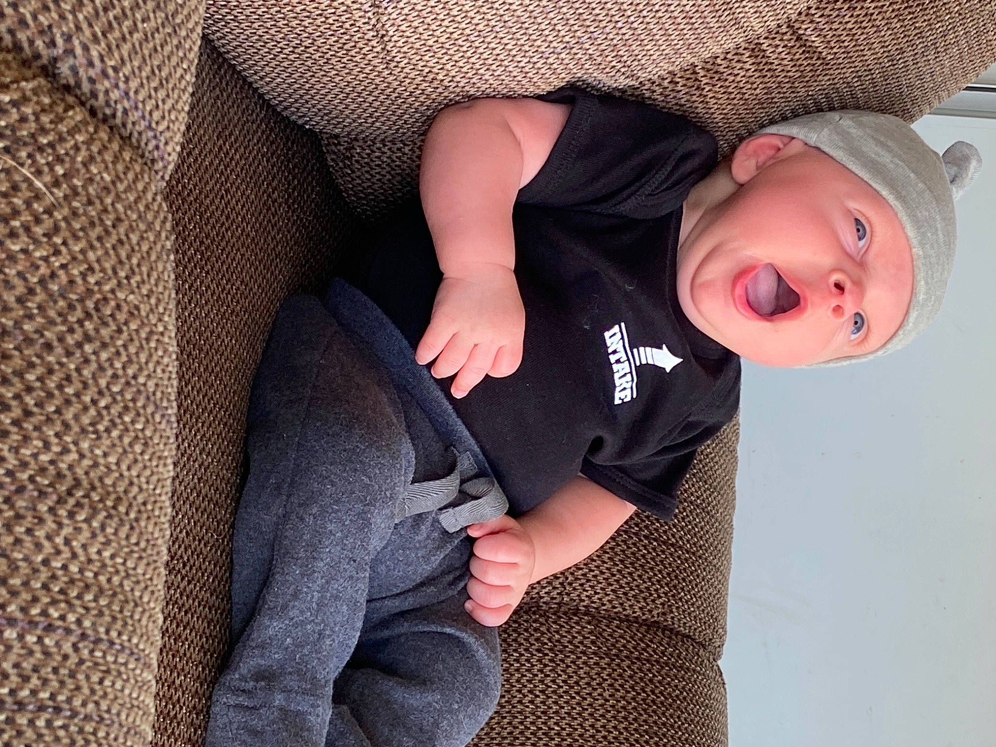 Lincoln joined the competition — help win amazing prizes! baby, baby_products, baby_toddler_clothing, cap, child, comfort, elbow, flash_photography, grey, hat, headgear, human_leg, joint, knee, pattern, person, sitting, sleeve, sun_hat, thigh