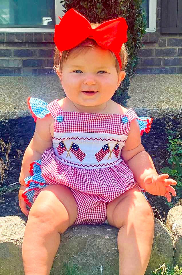 Ella Kay joined the competition — help win amazing prizes! baby_toddler_clothing, cap, dress, face, fun, grass, happy, hat, headgear, headwear, joy, lip, magenta, pattern, person, pink, plant, skin, sleeve, smile