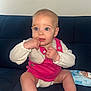 Layana participe au concours pour gagner de l'argent avec cette photo : baby, child, infant, blue_eyes, pink_clothing, white_shirt, sitting, couch, dark_blue_couch, baby_wipes, indoor, cute, curious, fingernail, skin, head, face, small_hands, legs, barefoot