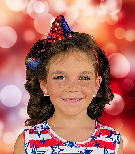 Kaylynn is registered to the contest to win money with this photo: beauty, blue, child, cone, costume_hat, electric_blue, event, fashion_accessory, fun, happy, head, headgear, joy, magenta, party_hat, party_supply, people, person, photograph, pink