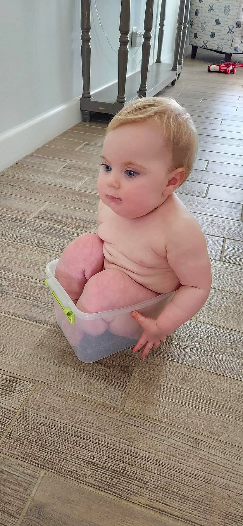 Coraline is registered to the contest to win money with this photo: baby, baby_products, baby_toddler_clothing, barefoot, bathing, cheek, chest, floor, flooring, foot, happy, hardwood, human_body, human_leg, leg, person, sitting, stomach, thigh, toddler