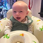 Michael joined the competition — help win amazing prizes! baby, infant, child, smiling, baby_seat, inflatable_seat, onesie, vest, open_mouth, face, eyes, hands, home_interior, nursery, star_print, moon_print, colorful, toy, clothing, portrait