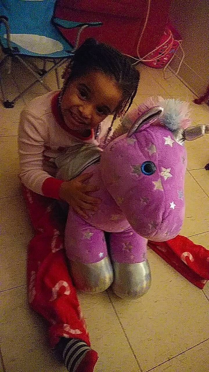 Laylani joined the competition — help win amazing prizes! baby, baby_toddler_clothing, baby_toys, child, fun, happy, joy, magenta, person, pink, plush, purple, room, sitting, sleeve, smile, stuffed_toy, toddler, toy