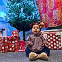 baby, child, christmas_tree, holiday, presents, gift_wrap, carpet, headband, indoor, festive, decorations, smiling, clothing, cute, celebration, holiday_lights, home, portrait, winter, seasonal