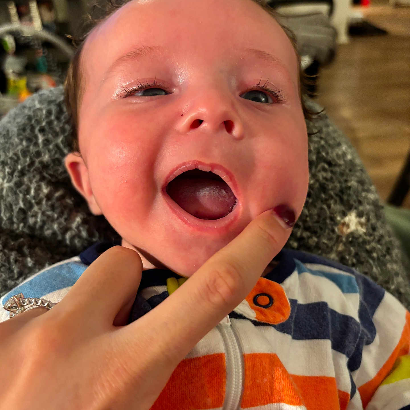 Mason is registered to the contest to win money with this photo: baby, bodypart, couch, crying, eating, face, finger, food, furniture, hand, head, mouth, nail, newborn, person, photography, portrait, sad, wrist