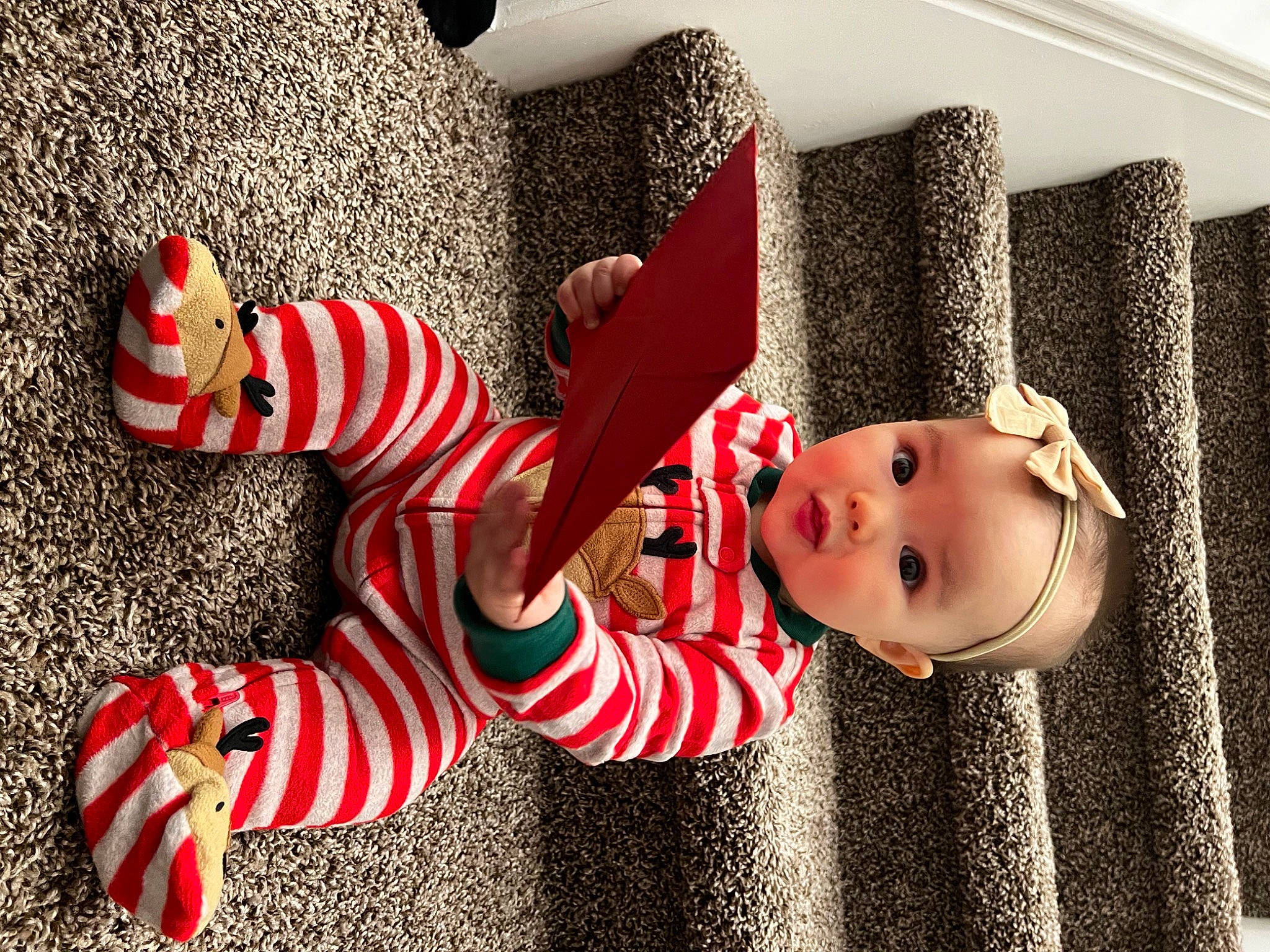 Mylah is registered to the contest to win money with this photo: baby, baby_toddler_clothing, carmine, child, christmas, christmas_decoration, christmas_eve, costume_hat, event, fashion_accessory, fictional_character, happy, hat, holiday, human_leg, pattern, person, sock, thigh, toddler